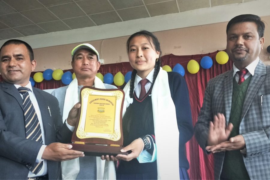 Dr. A B Karki, MD, Sikkim Milk Union Ltd. presenting SARASWATI KARKI MEMORIAL, Academic Excellence Award 2019-20 to Miss Kunga Dolma Bhutia on Childern's Day 2021